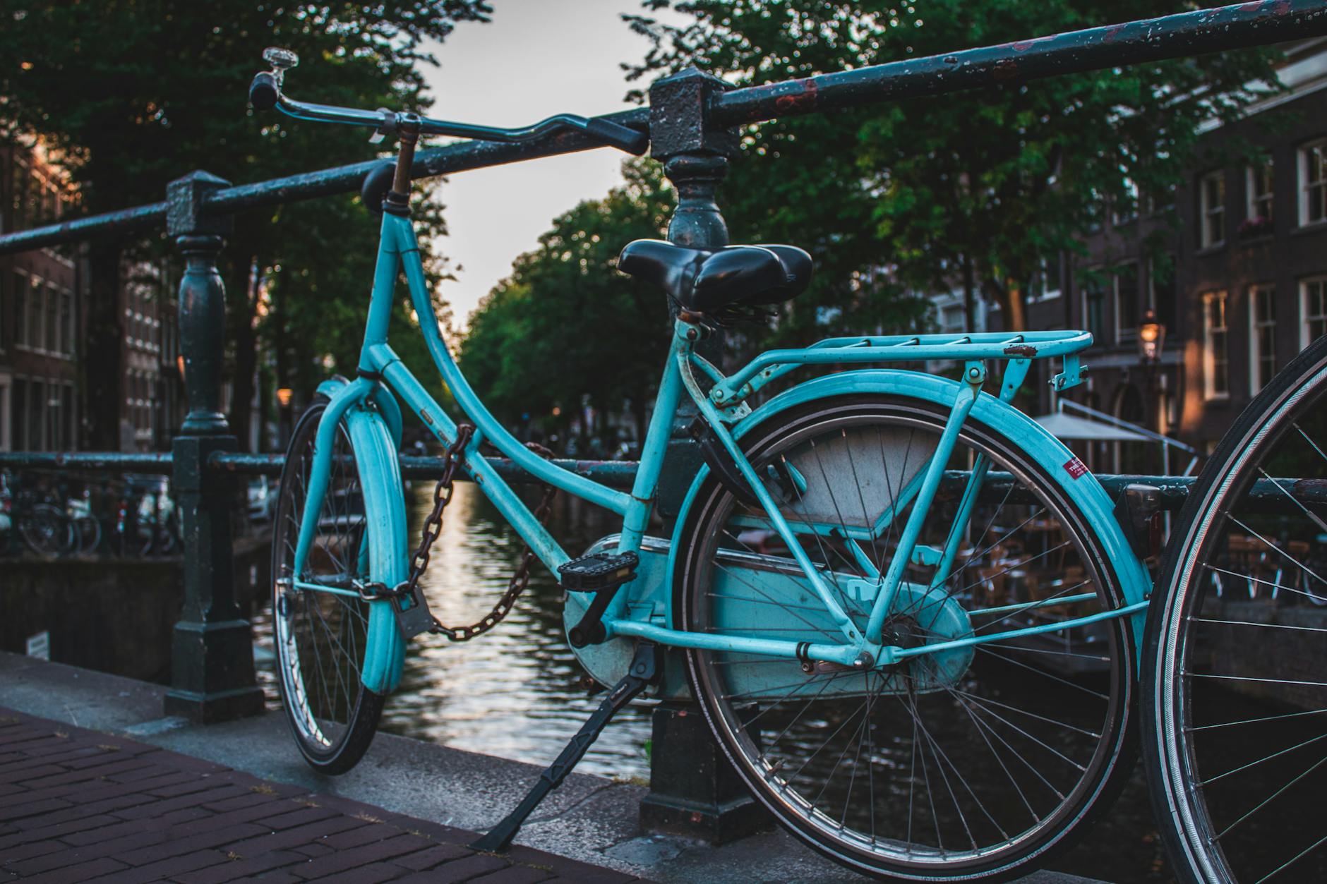 Bicycles lined along an Amsterdam canal, the city's most iconic mode of transport