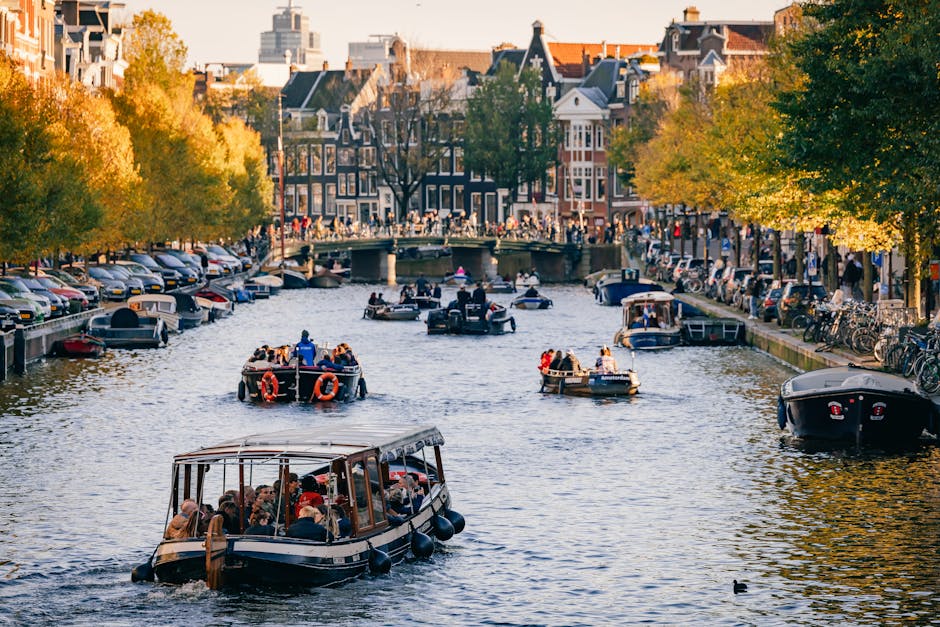 Amsterdam canal cruise boat sunset