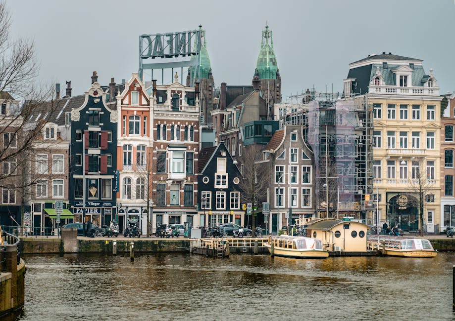 Amsterdam construction worker brick canal embankment
