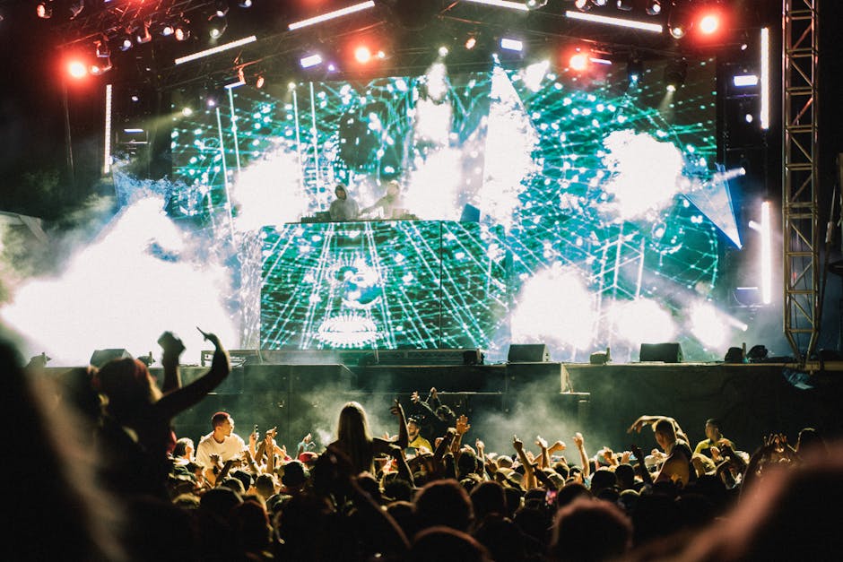 Festival crowd hands up music celebration
