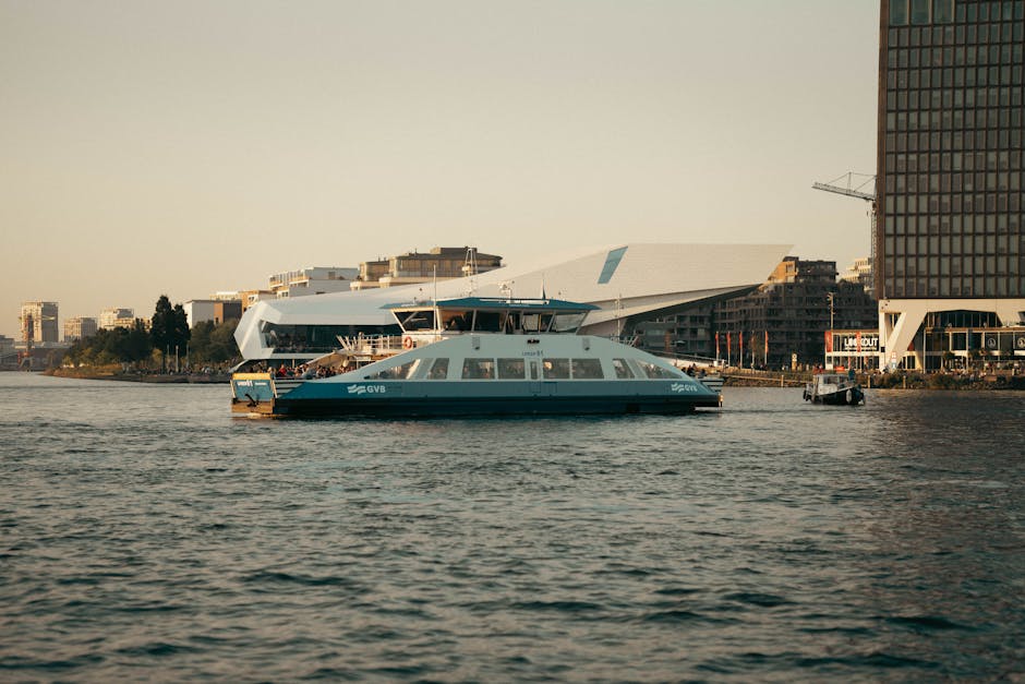 Boats and waterfront buildings on the IJ harbour in Amsterdam