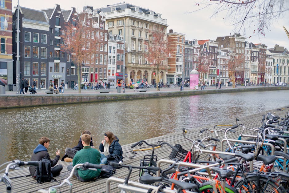 Amsterdam women friends laughing canal city