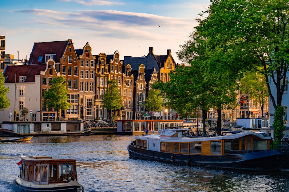 Amsterdam canal moored boats houses peaceful