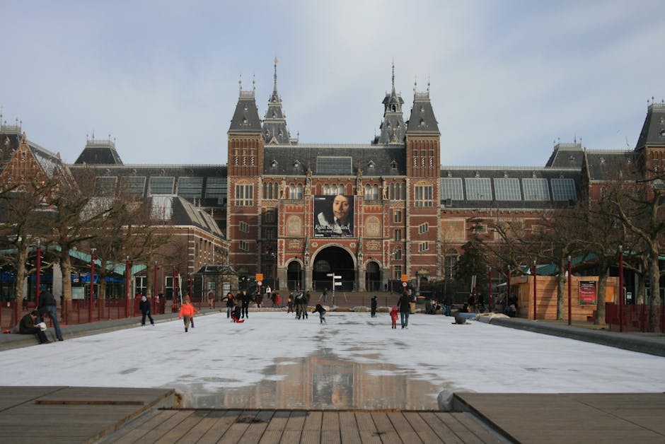 Visitors viewing The Night Watch at Rijksmuseum Amsterdam