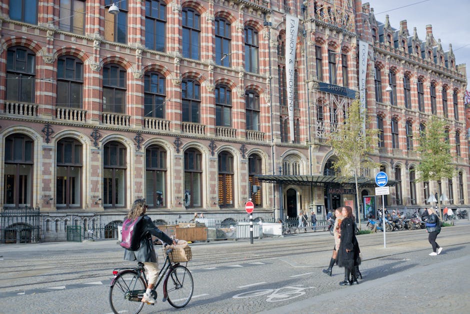 Amsterdam shopping street with stores and pedestrians