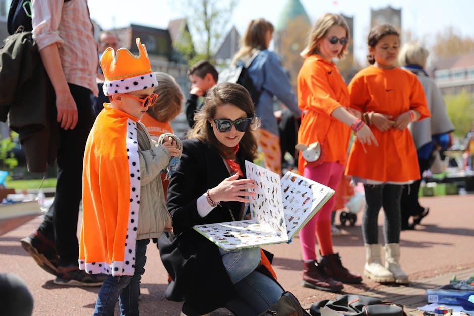 Kings Day Amsterdam crowds in orange clothing celebrating