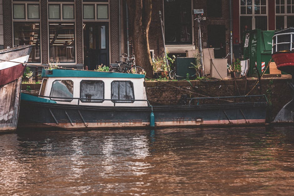 Kids on a small canal boat tour in Amsterdam