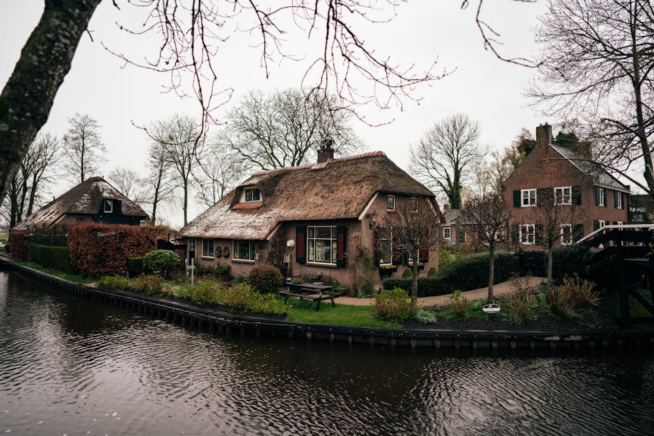 Giethoorn Netherlands canal village wooden bridge thatched