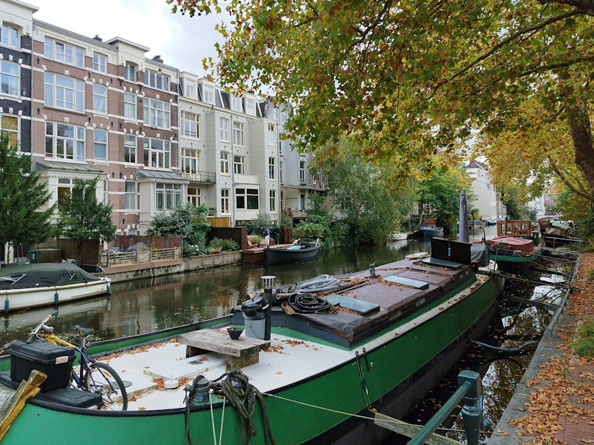 Amsterdam evening canal lit street tourists
