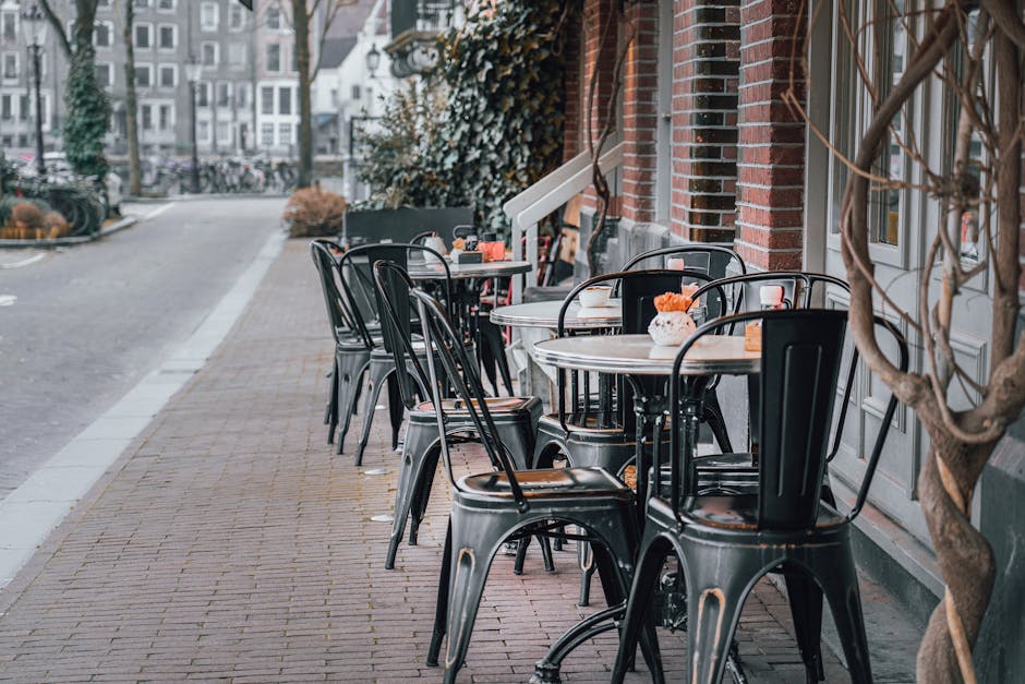 Solo traveler at Amsterdam cafe reading book