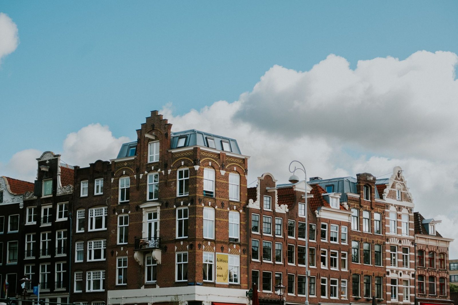 Grand historic canal houses in Amsterdam, many converted into five-star luxury hotels