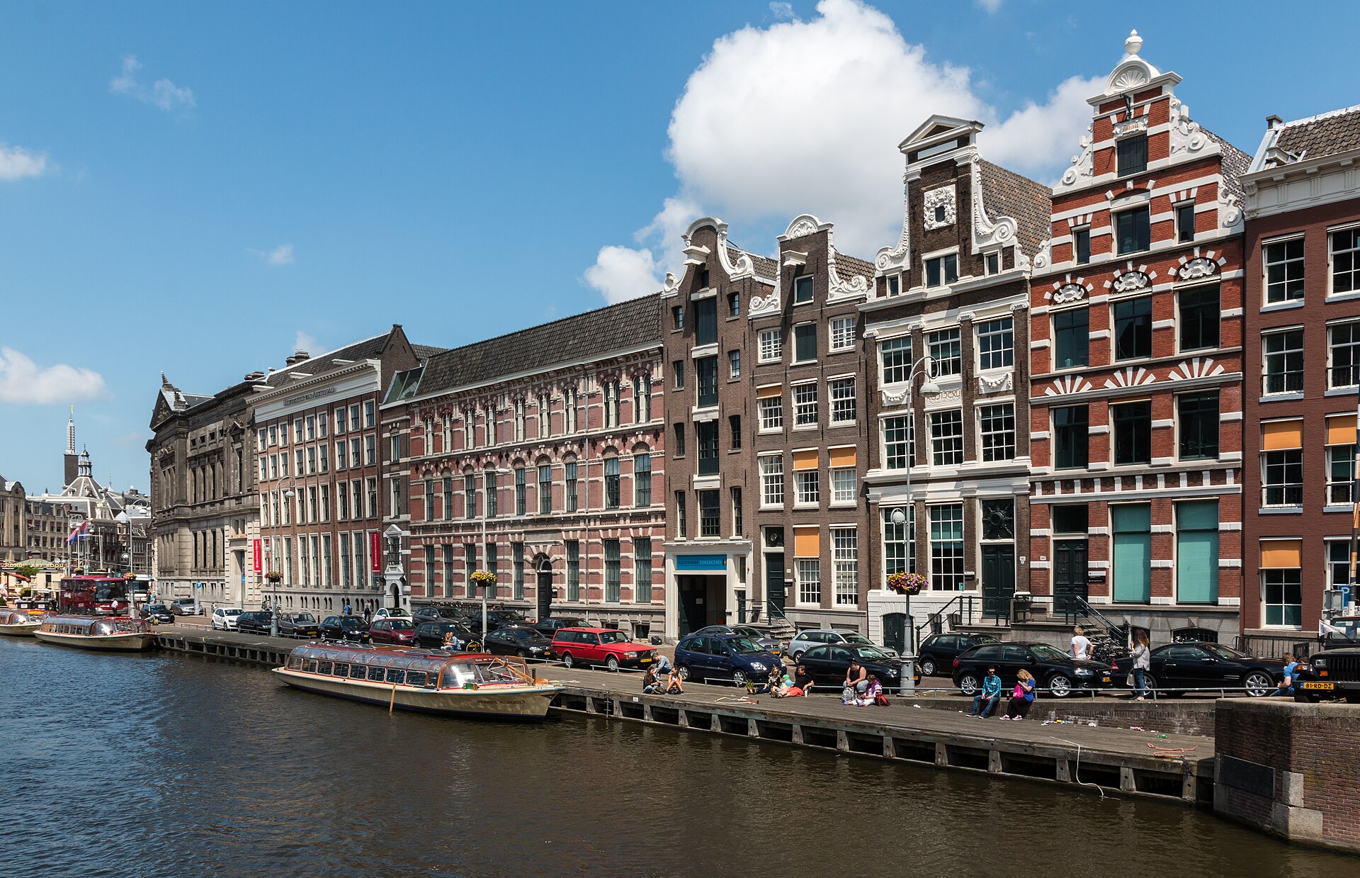 The Rokin canal in central Amsterdam with canal boats moored and gabled houses along the quay