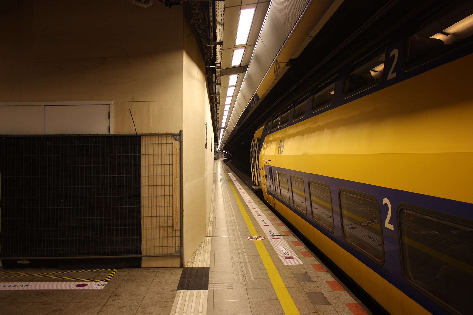 An NS double-decker intercity train at the underground Schiphol Airport railway platform